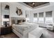 Luxurious main bedroom featuring tray ceiling, modern decor, and ample natural light at 1225 Amberley Way, Westfield, IN 46074