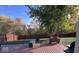 Wood deck overlooking the backyard with a privacy fence, grass, and mature trees at 13 Watson Dr, Trafalgar, IN 46181