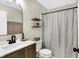 Modern bathroom with stylish fixtures, quartz countertop, shelves and shower at 13 Watson Dr, Trafalgar, IN 46181