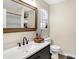 Modern bathroom with quartz countertop, stylish fixtures, and a window at 13 Watson Dr, Trafalgar, IN 46181