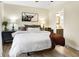 Serene bedroom featuring neutral tones, a ceiling fan, and access to an en-suite bathroom at 13 Watson Dr, Trafalgar, IN 46181