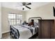 Comfortable bedroom with ample natural light, ceiling fan and TV at 13 Watson Dr, Trafalgar, IN 46181