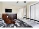 Bedroom with ceiling fan, closet, a TV, and an en-suite bathroom at 13 Watson Dr, Trafalgar, IN 46181