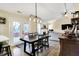 The dining room and eat-in kitchen seamlessly connect in an open-concept layout at 13 Watson Dr, Trafalgar, IN 46181