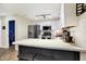 Updated kitchen with white cabinets, subway tile backsplash, stainless steel appliances, and a breakfast bar at 13 Watson Dr, Trafalgar, IN 46181