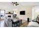 Comfortable living room with a fireplace, large sectional, and open layout at 13 Watson Dr, Trafalgar, IN 46181