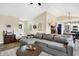 Spacious living room features a large sectional, round coffee table, and stylish decor at 13 Watson Dr, Trafalgar, IN 46181
