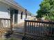 Exterior features a spacious wooden back deck with wood railings on a sunny day at 130 Hanover Dr, Morristown, IN 46161