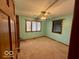 Comfortable bedroom with natural light, carpet flooring, and a ceiling fan at 130 Hanover Dr, Morristown, IN 46161