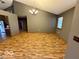 The dining room features an elegant chandelier and large window for natural light at 130 Hanover Dr, Morristown, IN 46161