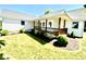 Charming single-story home with a welcoming front porch and well-maintained landscaping at 130 Hanover Dr, Morristown, IN 46161