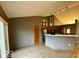 Spacious kitchen featuring plenty of counter space, tiled floor, and bar seating at 130 Hanover Dr, Morristown, IN 46161