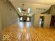 Spacious living room with vaulted ceilings, skylights, and beautiful laminate flooring at 130 Hanover Dr, Morristown, IN 46161