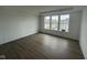 Spacious bedroom with hardwood floors and bright natural light from large windows at 13610 Grand Abbey Way, Fishers, IN 46037