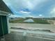 View of the neighborhood pond and green spaces at 13610 Grand Abbey Way, Fishers, IN 46037