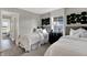 Charming bedroom with two twin beds, modern decor, and plenty of natural light streaming through the window at 13610 Grand Abbey Way, Fishers, IN 46037