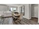 Dining area featuring a wooden table, beige chairs and modern decor at 13610 Grand Abbey Way, Fishers, IN 46037