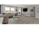 Comfortable living room featuring lots of light, neutral colors, plush seating, and modern accents at 13610 Grand Abbey Way, Fishers, IN 46037