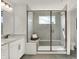 Bathroom featuring a glass shower with a built-in bench and a tiled shower at 13622 Grand Abbey Way, Fishers, IN 46037
