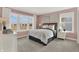 Charming bedroom with large windows, pink walls, and stylish decor at 13622 Grand Abbey Way, Fishers, IN 46037