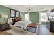 A stylish bedroom with earth tone accents, a modern light fixture, and picture frame molding at 13622 Grand Abbey Way, Fishers, IN 46037