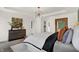 A well-lit bedroom with a decorative mirror, and modern earth tone decor at 13622 Grand Abbey Way, Fishers, IN 46037
