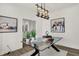 Stylish office featuring modern decor, including a glass desk, artwork, and ample lighting at 13622 Grand Abbey Way, Fishers, IN 46037
