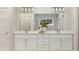Bright bathroom features a double sink vanity with quartz countertop and modern fixtures at 13634 Grand Abbey Way, Fishers, IN 46037