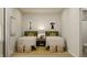 Playful bedroom featuring matching twin beds and colorful alphabet themed wallpaper at 13634 Grand Abbey Way, Fishers, IN 46037