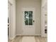 Welcoming entryway with light wood flooring and a door with glass inserts at 13634 Grand Abbey Way, Fishers, IN 46037