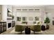 Comfortable living room features a fireplace, plush seating, and ample natural light at 13634 Grand Abbey Way, Fishers, IN 46037