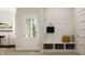 Mudroom features coat hooks, a built-in bench, and decorative baskets for storage at 13634 Grand Abbey Way, Fishers, IN 46037