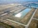Expansive aerial view of a new housing development with ponds and roads at 1366 Foxtail Ln, Greenwood, IN 46143
