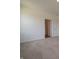 Spacious bedroom with neutral carpet and an open doorway to another room at 1366 Foxtail Ln, Greenwood, IN 46143