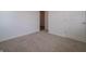 This bedroom features neutral carpeting and a walk-in closet at 1366 Foxtail Ln, Greenwood, IN 46143