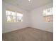 Well-lit bedroom featuring carpet and windows offering neighborhood views at 1366 Foxtail Ln, Greenwood, IN 46143