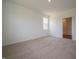Neutral bedroom featuring carpet flooring and a large window for natural light at 1366 Foxtail Ln, Greenwood, IN 46143