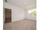 Inviting bedroom with a large window and an open view to the adjacent room at 1366 Foxtail Ln, Greenwood, IN 46143