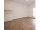 Open dining area with modern flooring and a glass door leading to the outside at 1366 Foxtail Ln, Greenwood, IN 46143