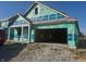 New construction home with a large two-car garage and a covered front porch at 1366 Foxtail Ln, Greenwood, IN 46143