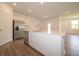 Well-lit kitchen showcasing stainless steel appliances, an island, and ample cabinet space at 1366 Foxtail Ln, Greenwood, IN 46143