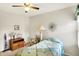 Cozy bedroom featuring a ceiling fan, wood furnishings, and a quaint lamp at 145 W Old South St, Bargersville, IN 46106