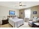 Bedroom with patterned walls, a large painting, and a cozy chair, creating a comfortable setting at 145 W Old South St, Bargersville, IN 46106