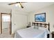 Cozy bedroom featuring a ceiling fan, closet, and natural light, making it an inviting space at 145 W Old South St, Bargersville, IN 46106