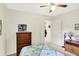 Bright bedroom featuring a ceiling fan and wooden dresser at 145 W Old South St, Bargersville, IN 46106