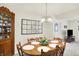 Bright dining room with wooden table, chairs, and a decorative quilt at 145 W Old South St, Bargersville, IN 46106