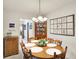 Warm dining room with a wooden table set for six and a built-in cabinet at 145 W Old South St, Bargersville, IN 46106