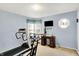 Exercise room featuring workout equipment, natural light and a sewing area at 145 W Old South St, Bargersville, IN 46106
