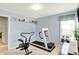 Exercise room with workout equipment and natural light from the window at 145 W Old South St, Bargersville, IN 46106