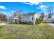Charming one-story home with a well-manicured lawn and inviting front porch under a beautiful sky at 145 W Old South St, Bargersville, IN 46106